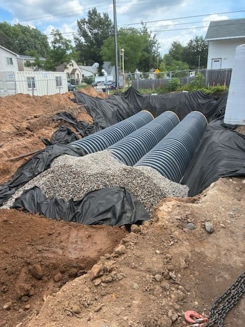 Gallery photos for Underground Filtration Pond Keeps This Tight Building Site Moving: Image #3